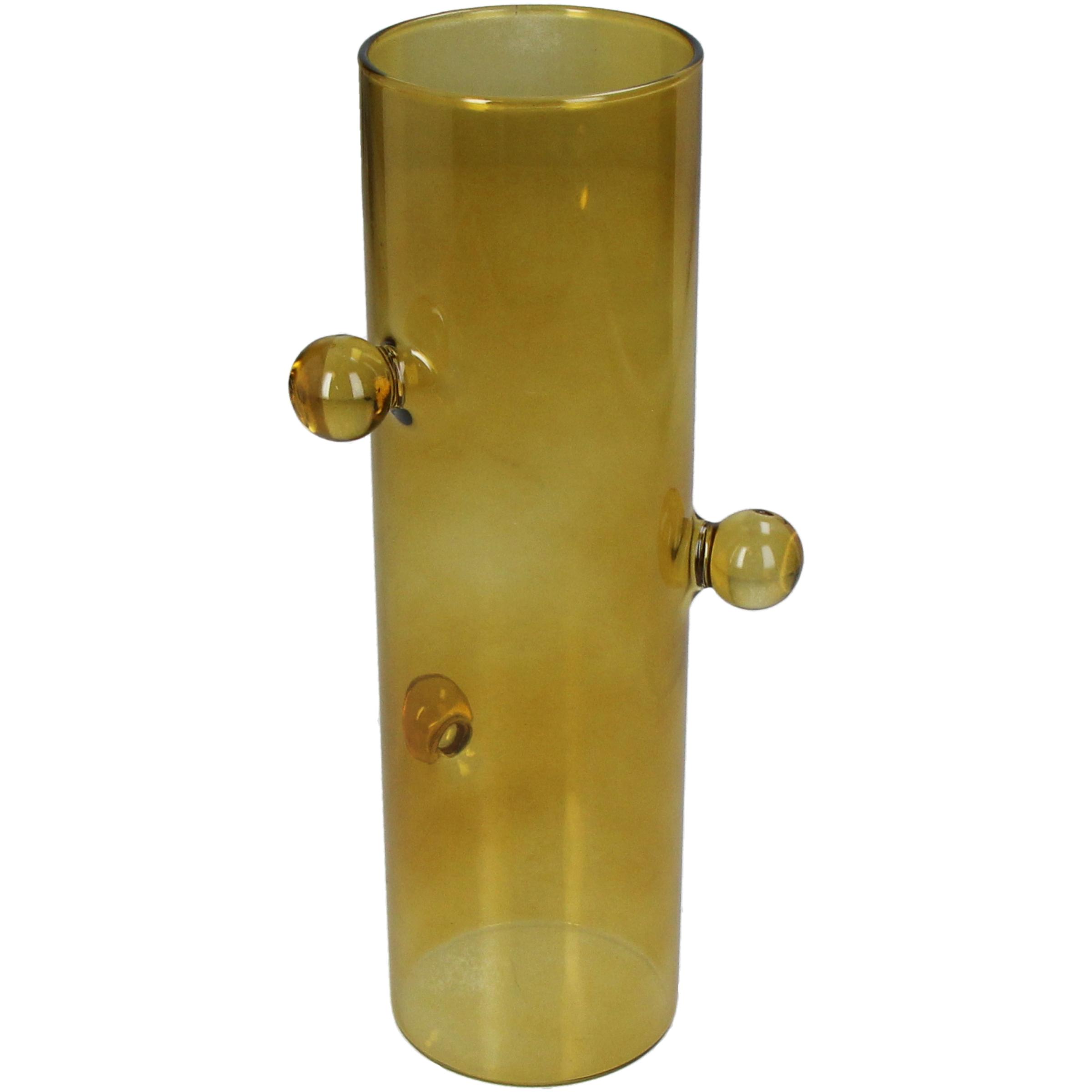 Vase jaune avec boules