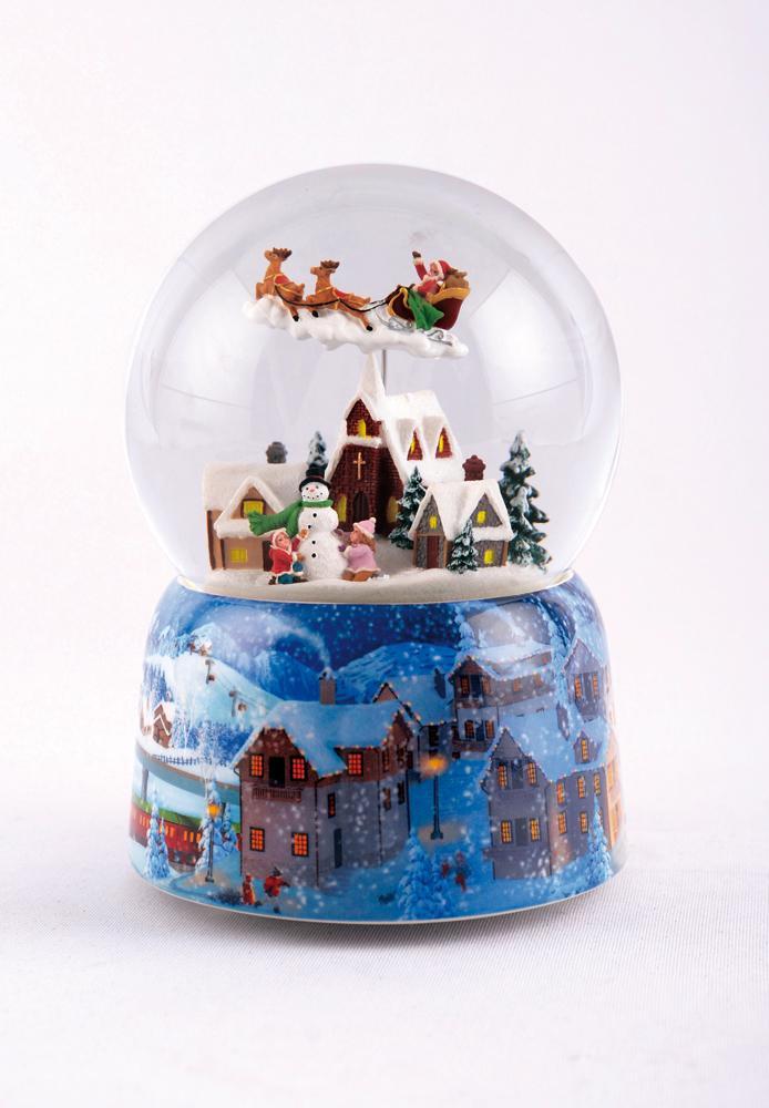 Boule à neige Père Noël en vol dans son traineau